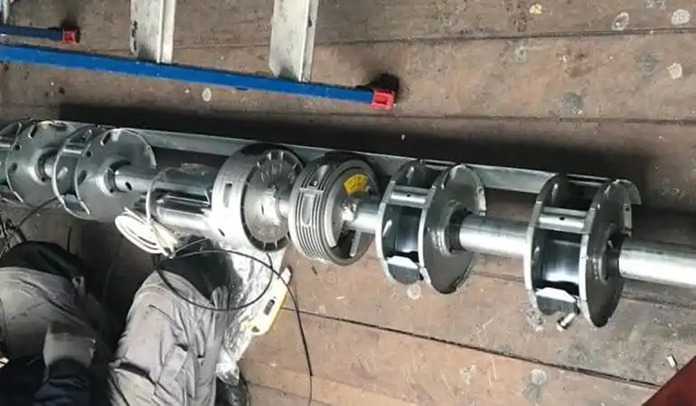 Changement axe motorisé rideau métallique Avon 77210